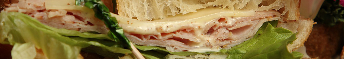 Eating Sandwich at Mokas Cafe restaurant in Salina, KS.